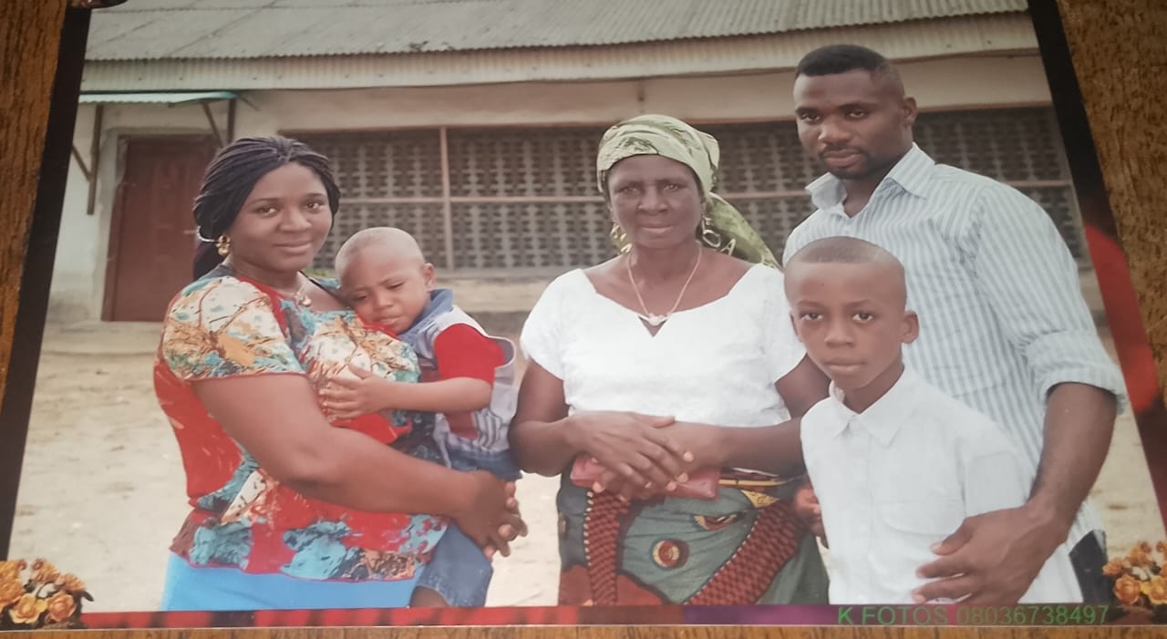 Josephine with family members outside a home