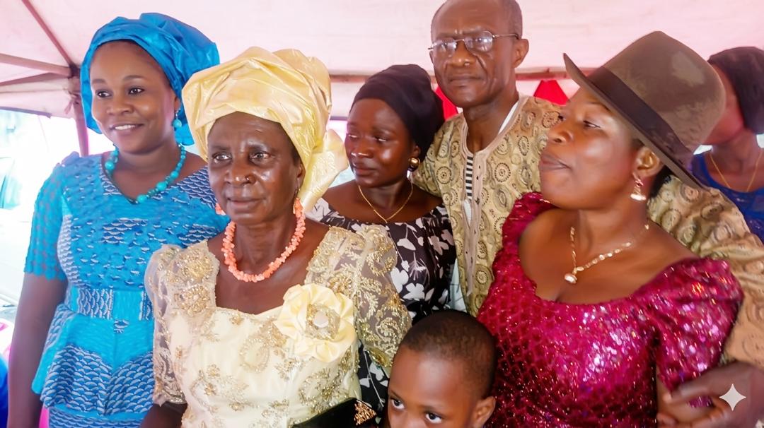 Josephine with family members in colourful traditional clothing